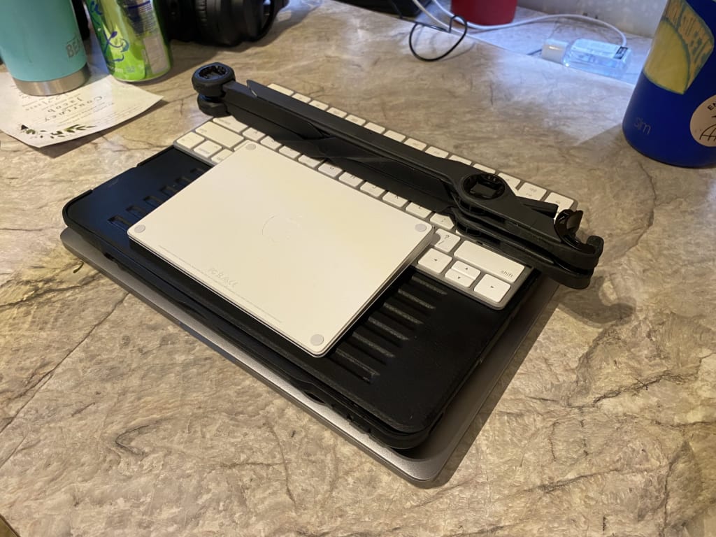 Alex's laptop setup, folded and sitting neatly on the countertop