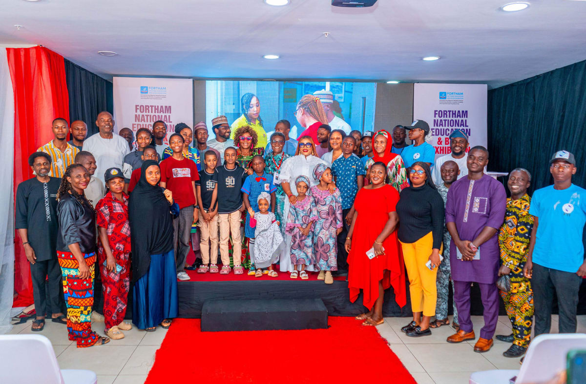 Participants celebrate together on stage