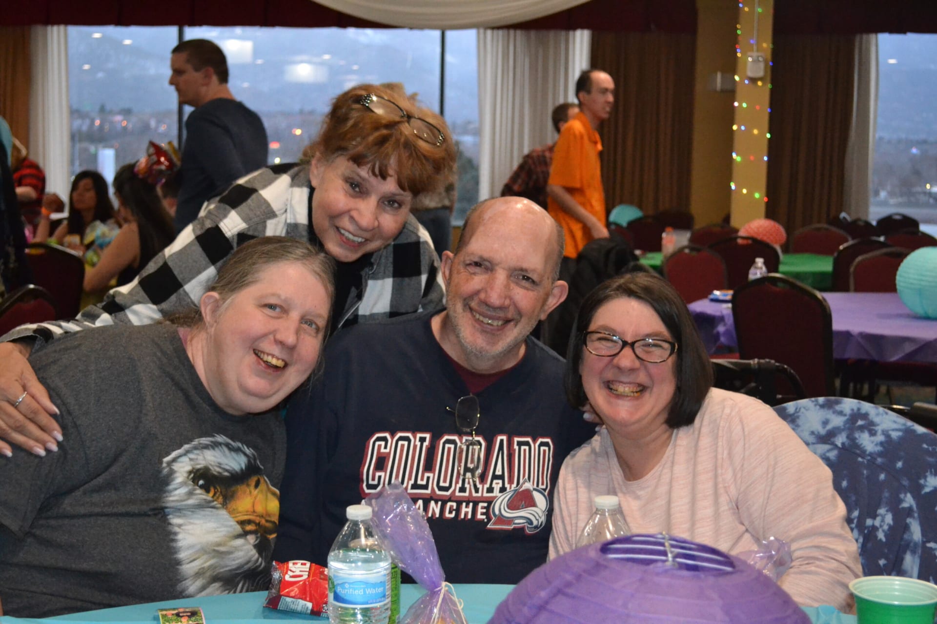 Community members with intellectual and developmental disabilities smiling together at a gathering