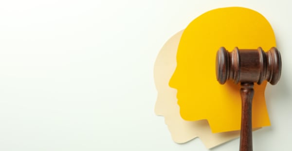 Gavel on a yellow background representing policy and systems advocacy