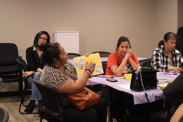 Parents participating in an art activity during a Parent Empowerment group session