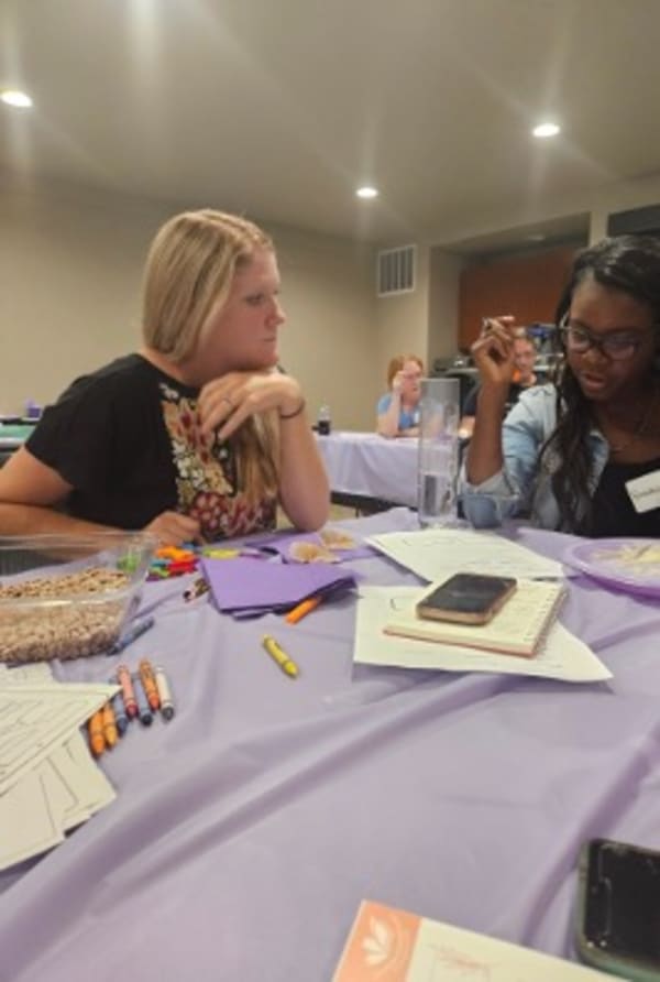 Families participating in a hands-on Sensory Workshop Series