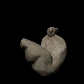 Seated figure with elevated legs