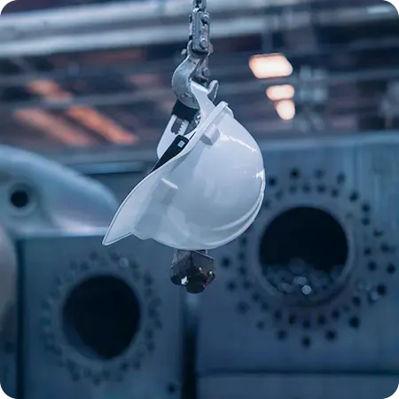 Hard hat hanging on industrial hook