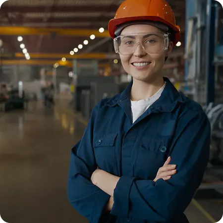 Worker wearing safety glasses and hard hat