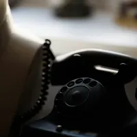 Image of a black desk telephone