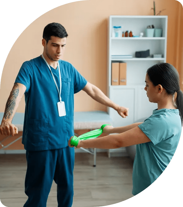 Physical therapist working with patient at home