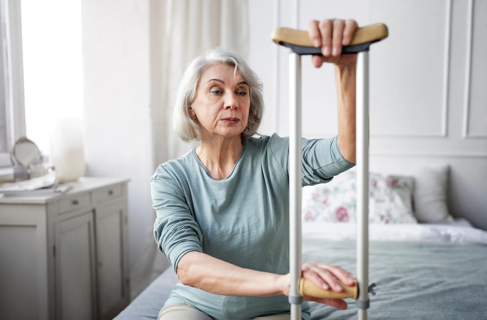 Physical therapist assisting senior patient with neurological rehabilitation