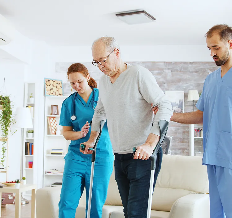 Physical therapist assisting senior patient with neurological rehabilitation