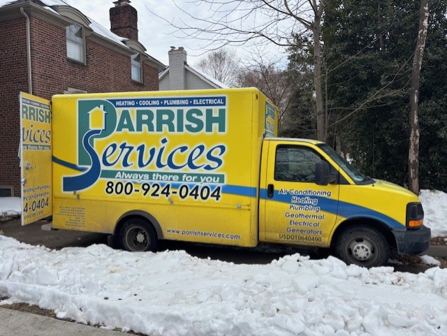 A Parrish Services technician arrives in a clearly branded van, delivering reliable home heating and plumbing service with professionalism.