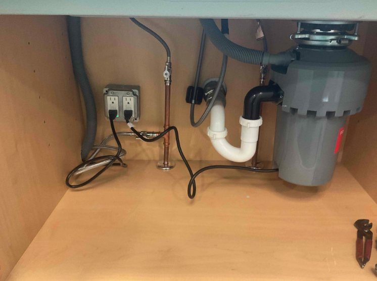 Hope Plumbing installed a tidy, reliable under-sink garbage disposal and plumbing layout that highlights craftsmanship and lasting performance.
