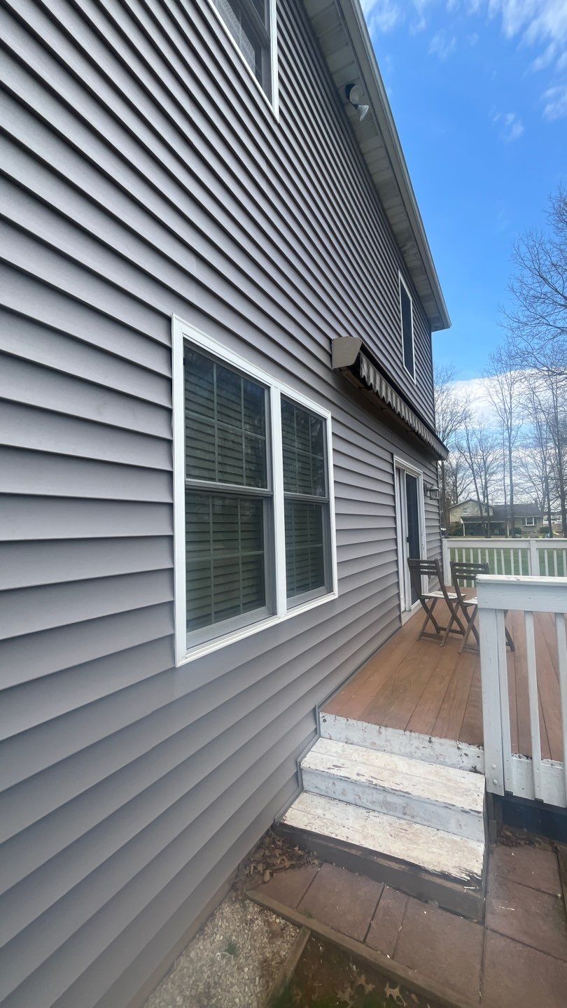 Showcasing durable siding and a clean exterior finish, Mast Roofing & Construction brings dependable craftsmanship to your home.