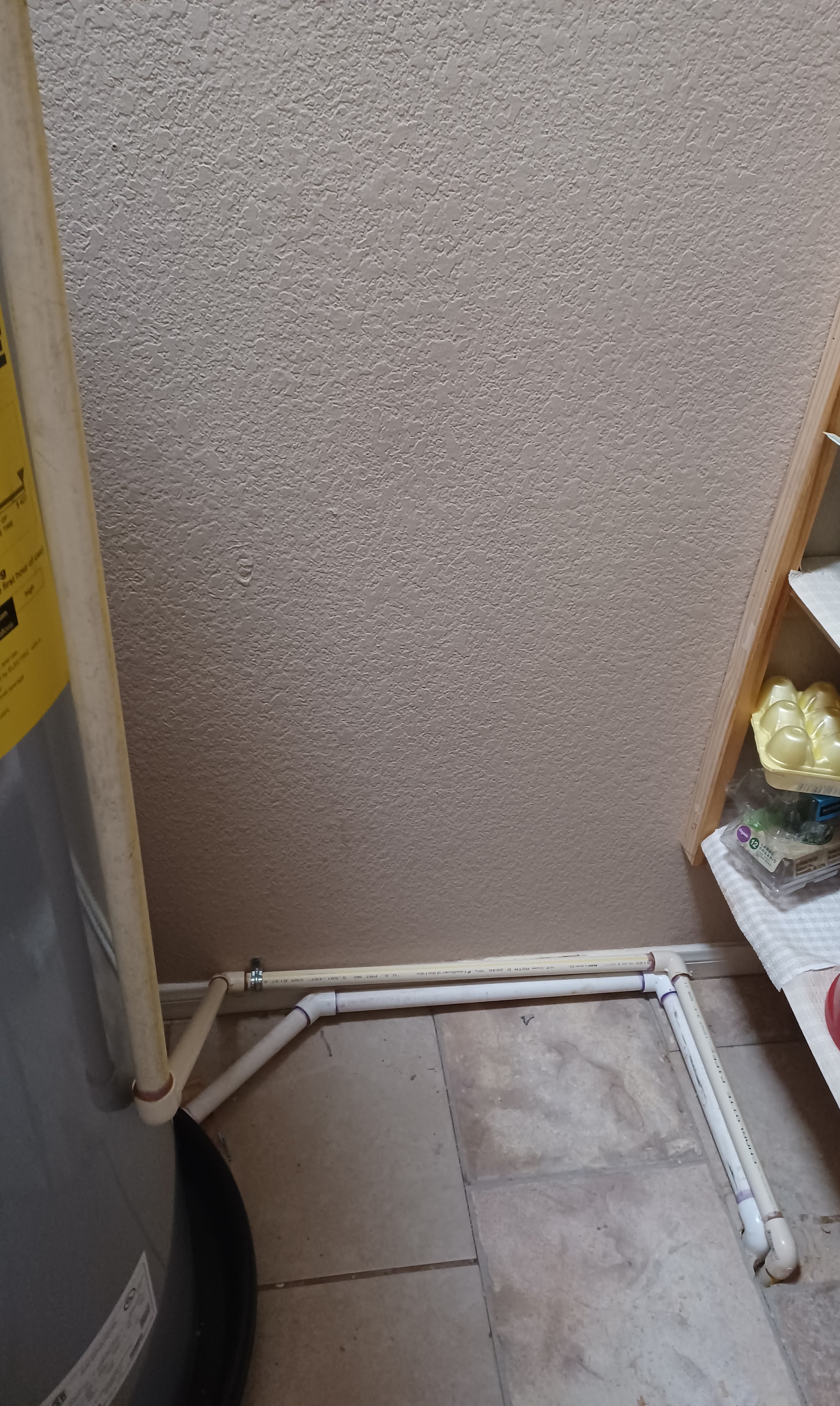 Clean, neatly installed plumbing lines show the craftsmanship customers trust from Abacus Plumbing, Air Conditioning & Electrical when servicing water heaters.