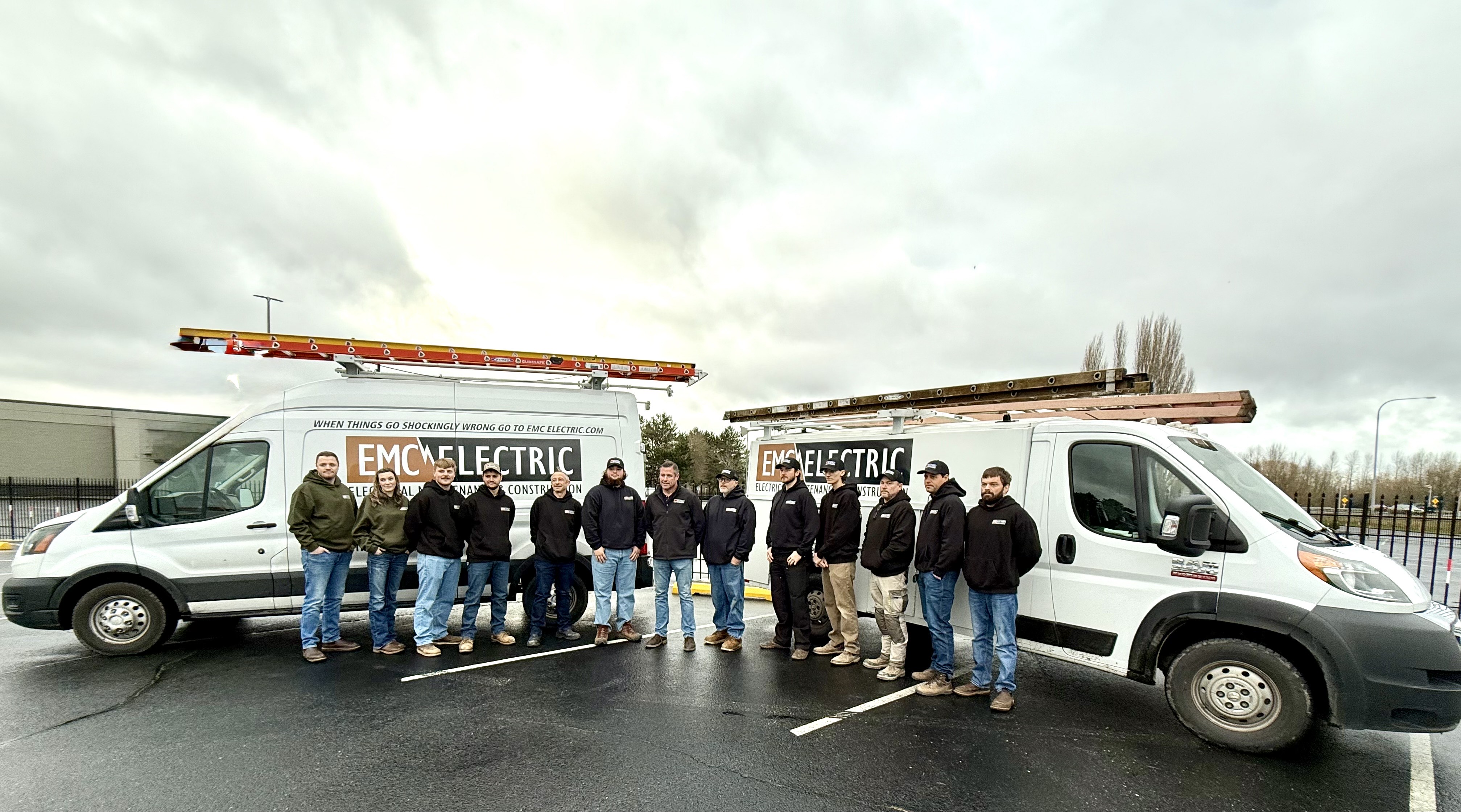 EMC Electric Inc showcases its dedicated team and state-of-the-art service vehicles, ready to power your project with precision and care.