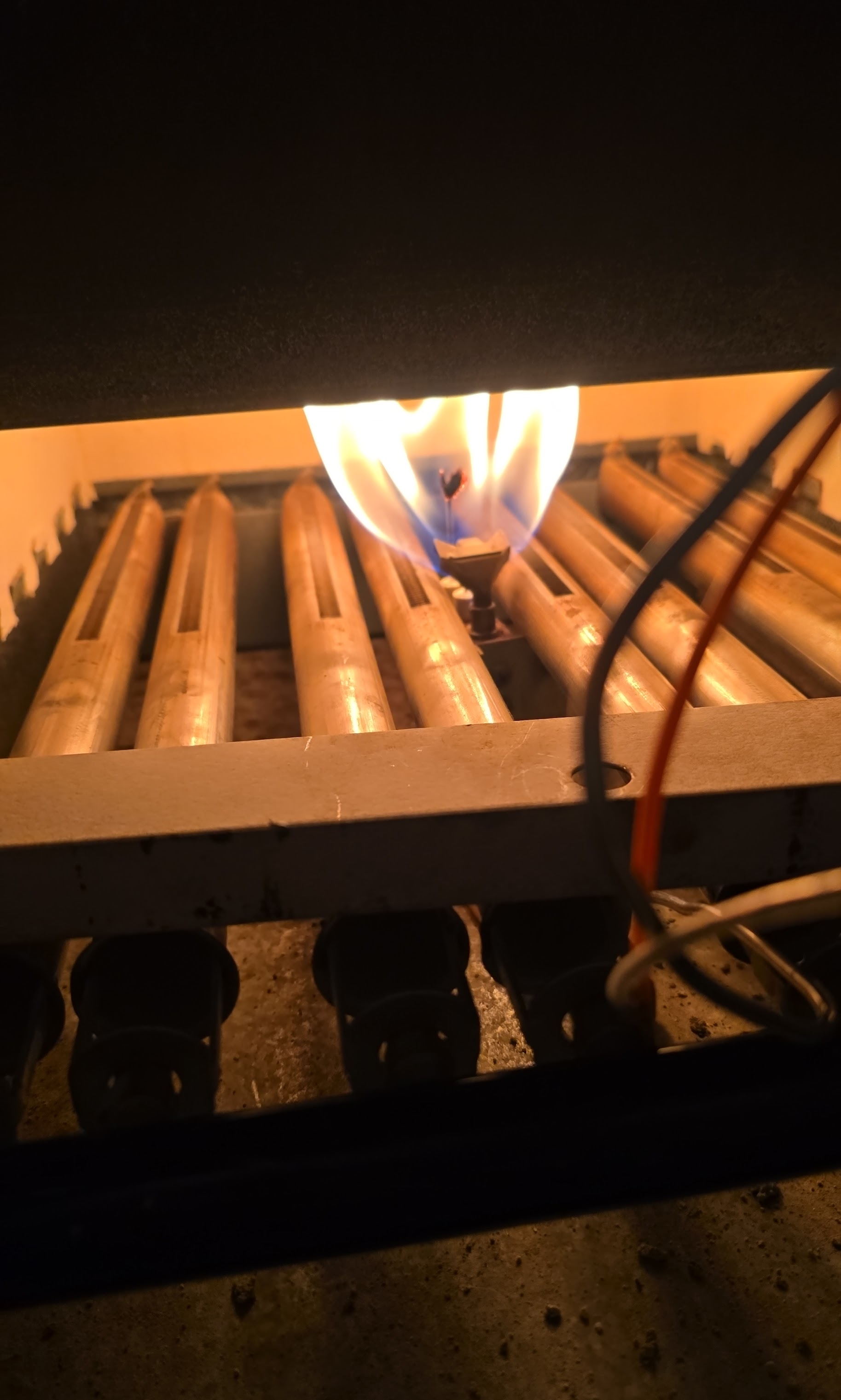Confident flame ignition and tidy burner work show Oasis Heating and Cooling’s commitment to reliable, safe furnace performance.