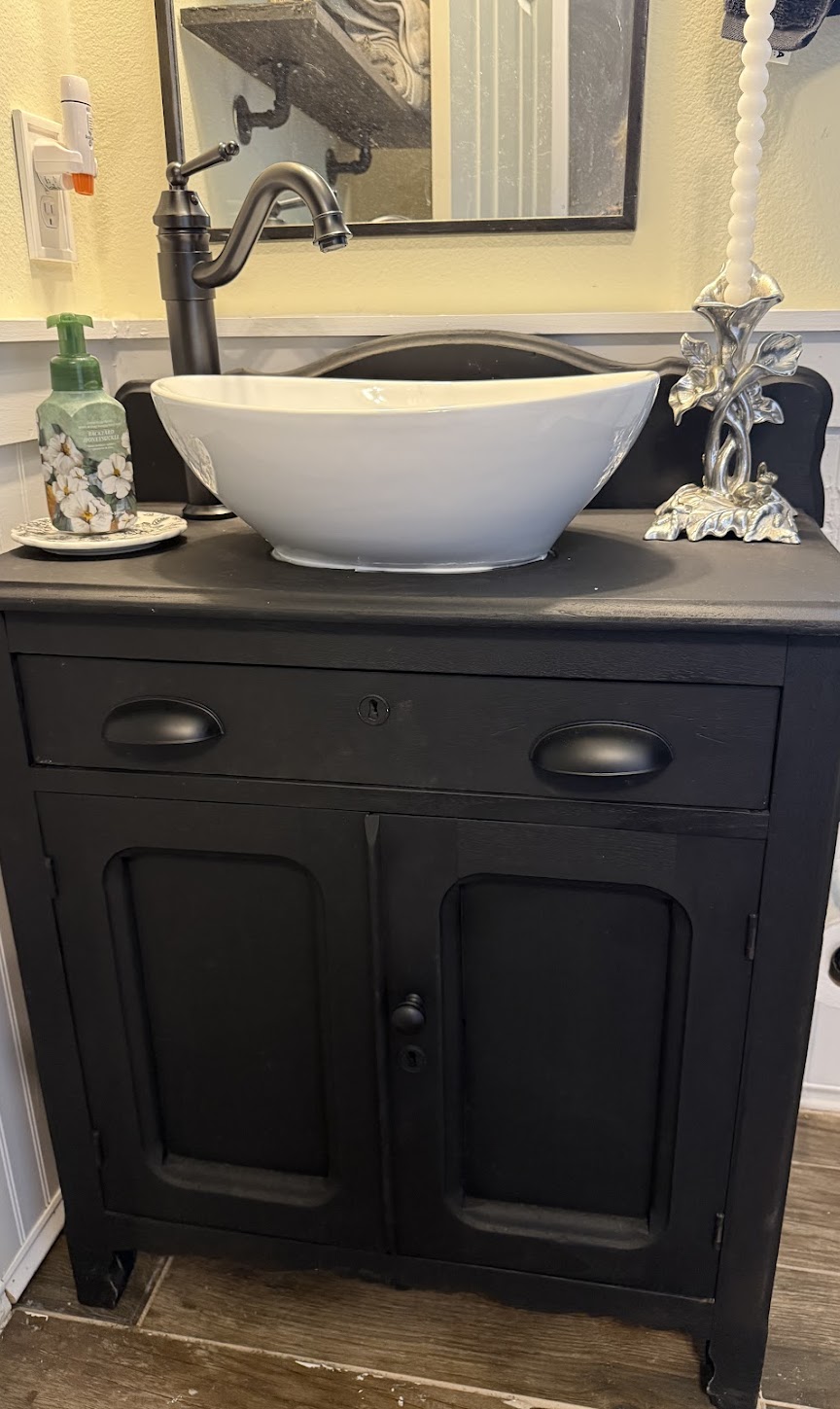 A crisp vessel sink and expertly installed faucet showcase the craftsmanship customers trust from Abacus Plumbing, Air Conditioning, & Electrical.