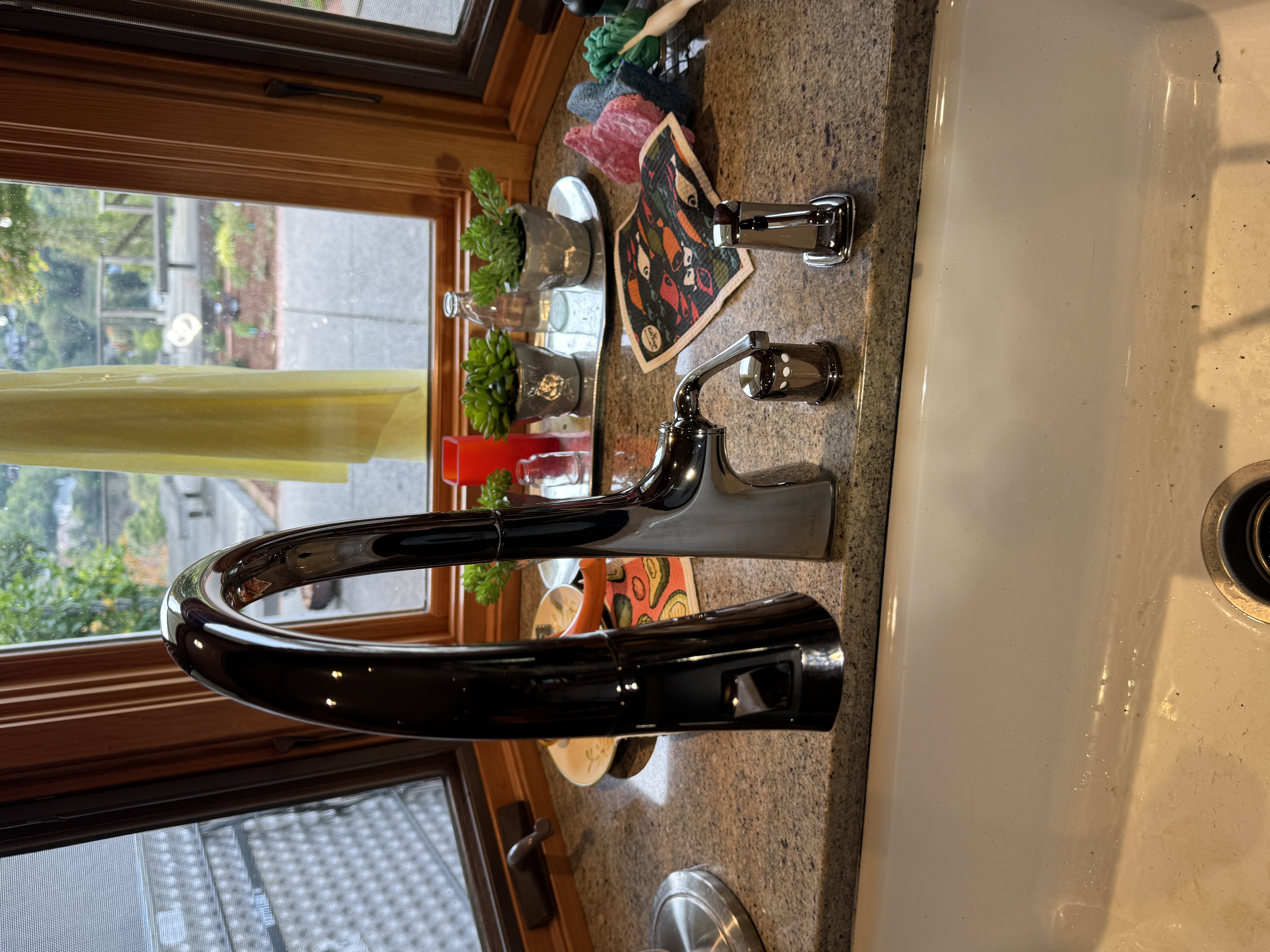 A sleek chrome kitchen faucet installed with care adds lasting value and polished craftsmanship to your home with Big Island Plumbing.