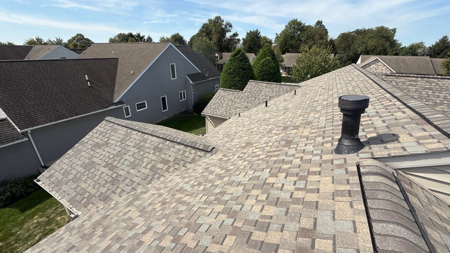 Showcasing durable craftsmanship and attention to detail on a suburban roof, Mosaic Roofing & Exteriors delivers lasting results homeowners trust.