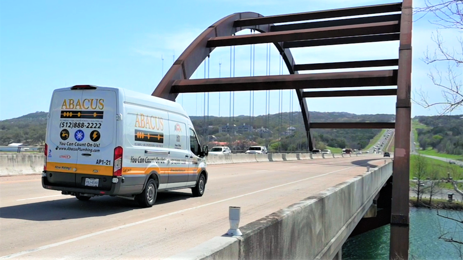 A clean Abacus Plumbing, Air Conditioning, & Electrical service van on the road shows reliable, professional response across the community.