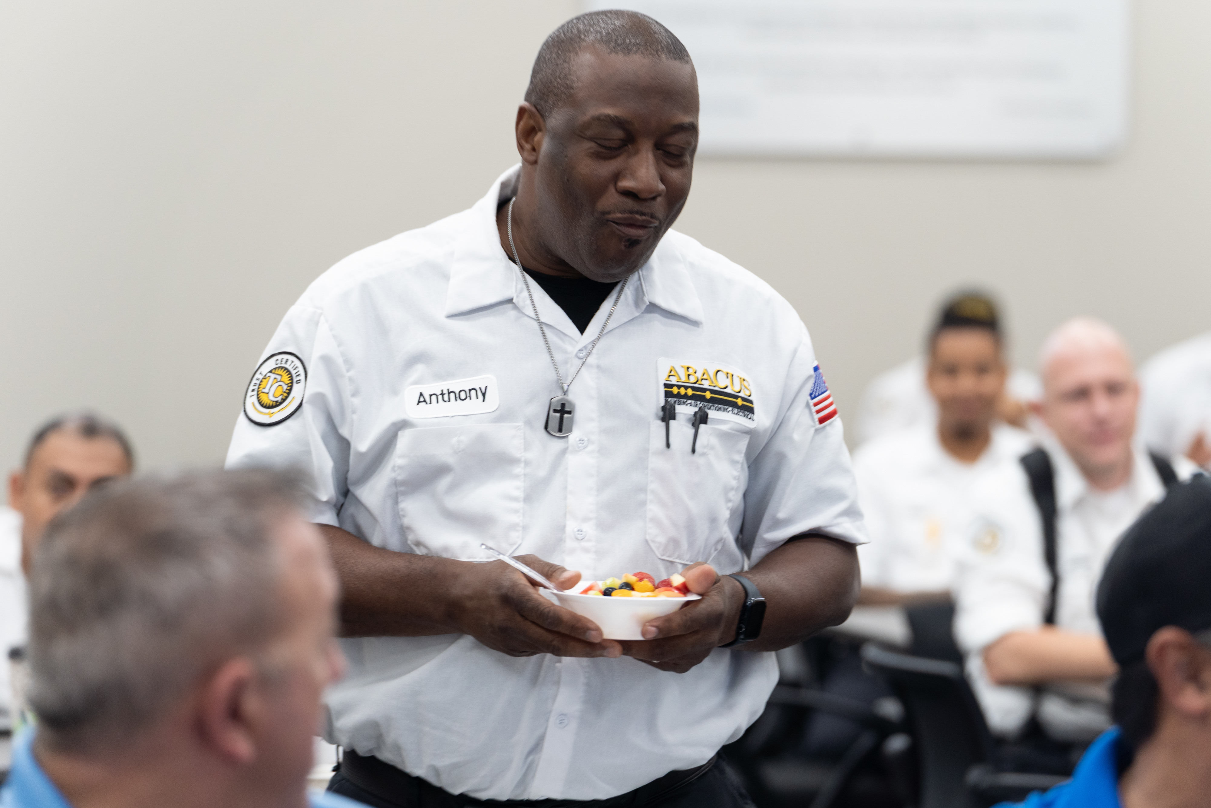 A friendly team moment highlights the professional service and trustworthy culture at Abacus Plumbing, Air Conditioning, & Electrical.