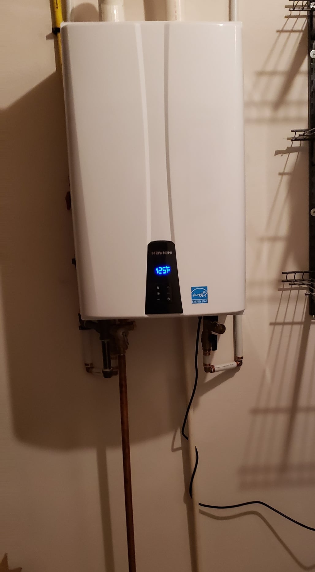 Experience modern plumbing solutions with Ostrom Electrical Plumbing Heating & Air Conditioning's efficient tankless water heater installation.