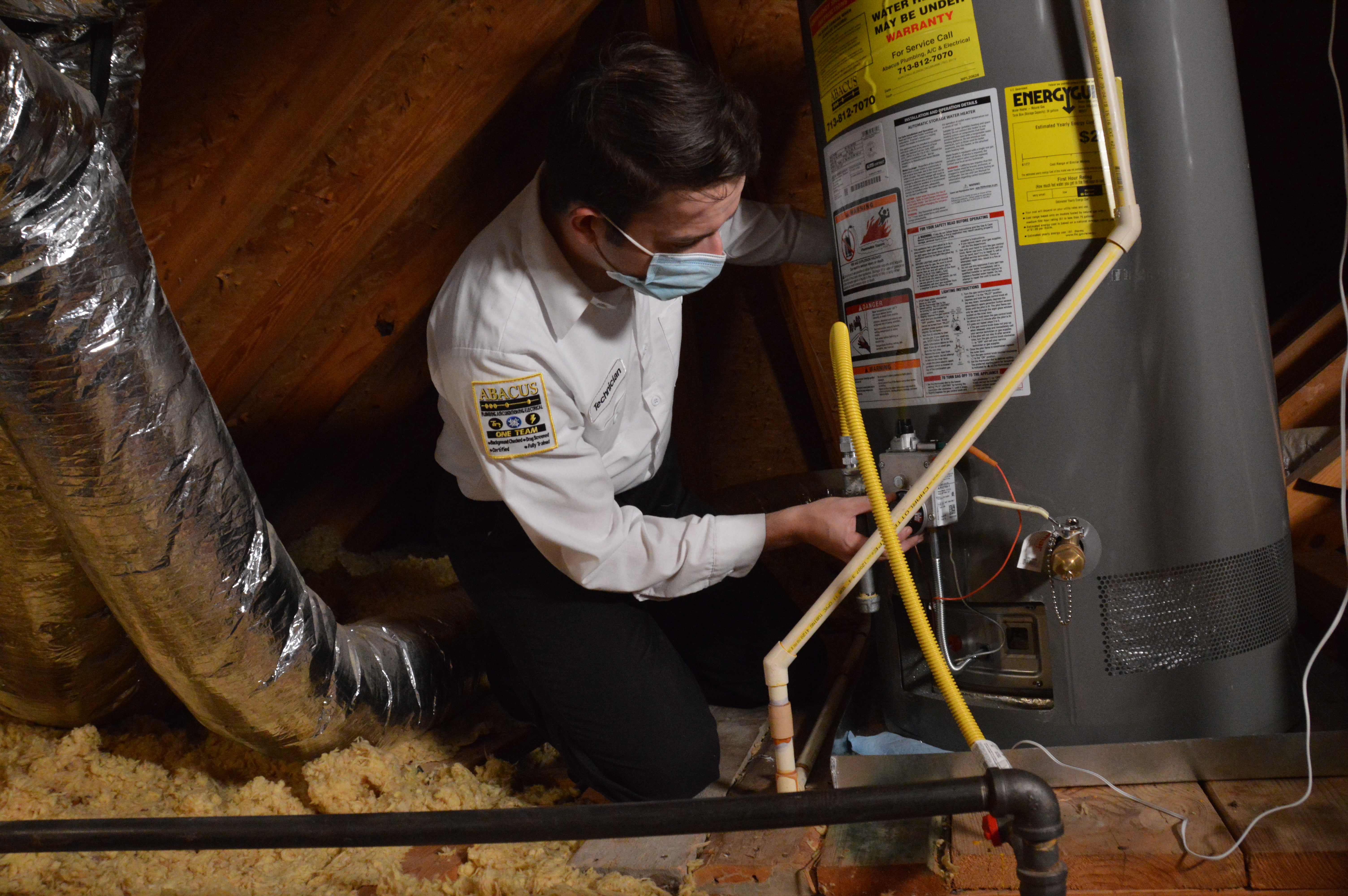 A skilled technician from Abacus Plumbing, Air Conditioning, & Electrical ensures safe, professional water heater service with careful attention to detail.