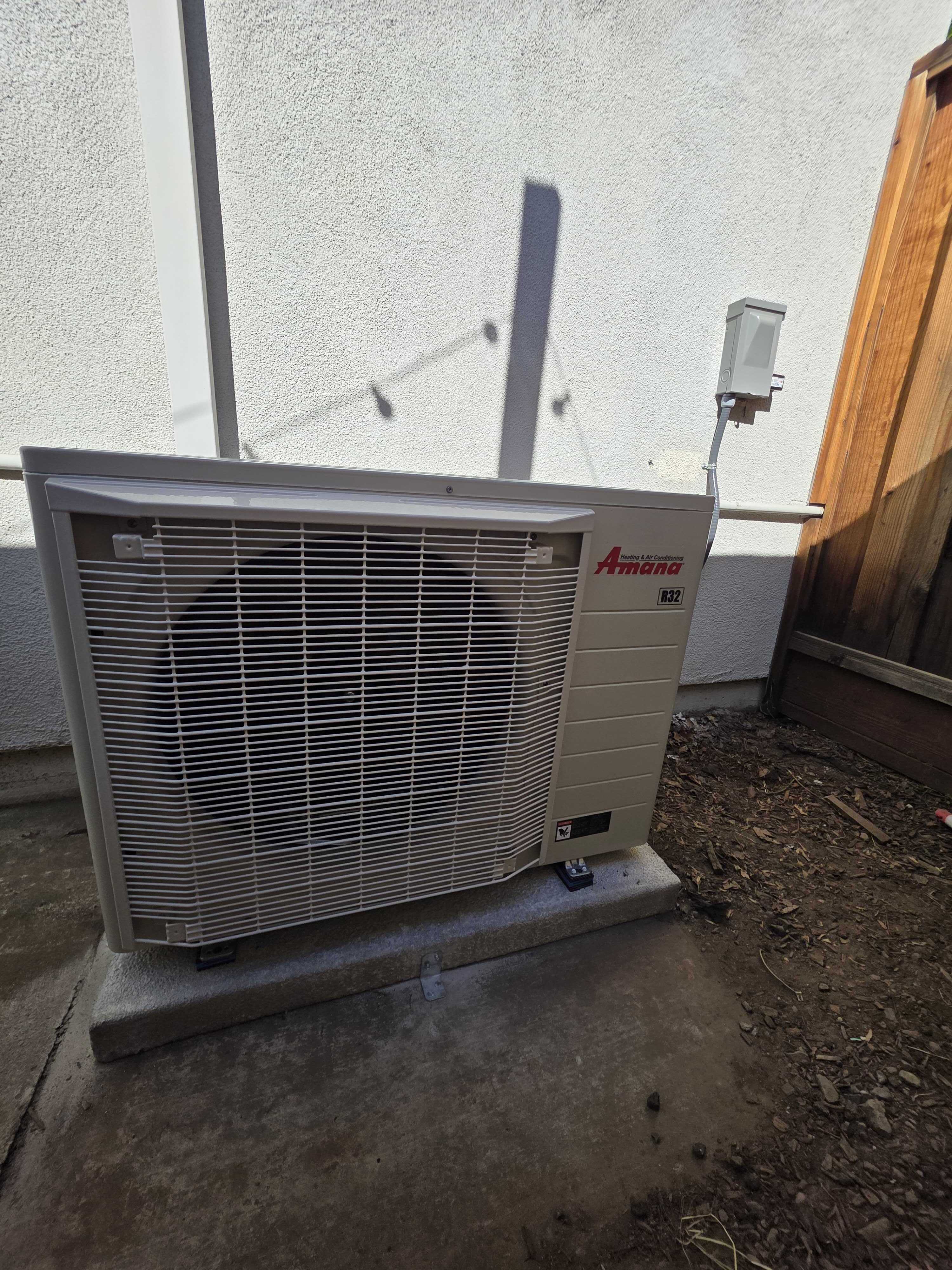 Upgrade Home Services presents a clean, professionally installed outdoor HVAC condenser that demonstrates reliable craftsmanship and safety.