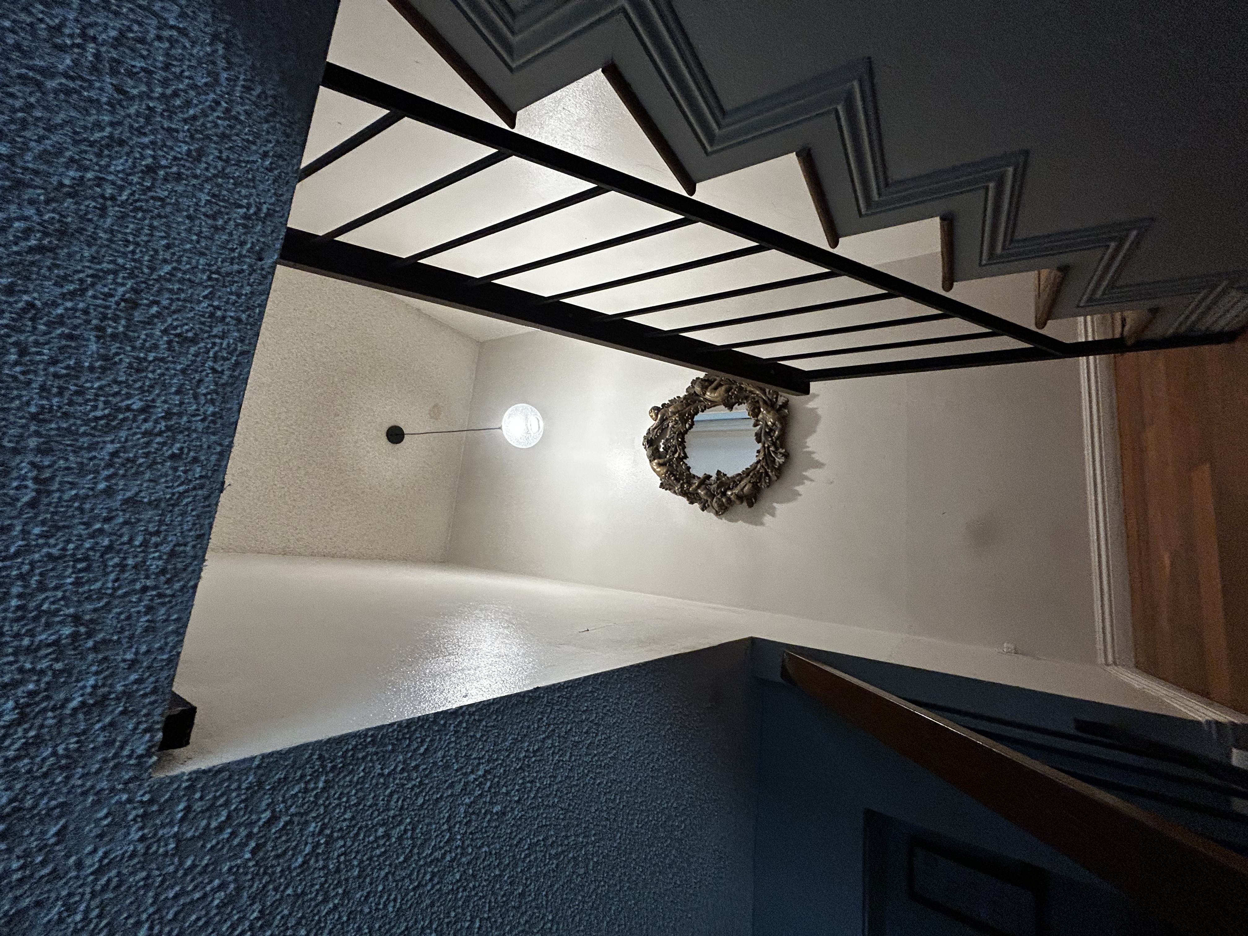 Powell Electric installed this clean, well-lit stair pendant to brighten the entry and showcase reliable, safe lighting.