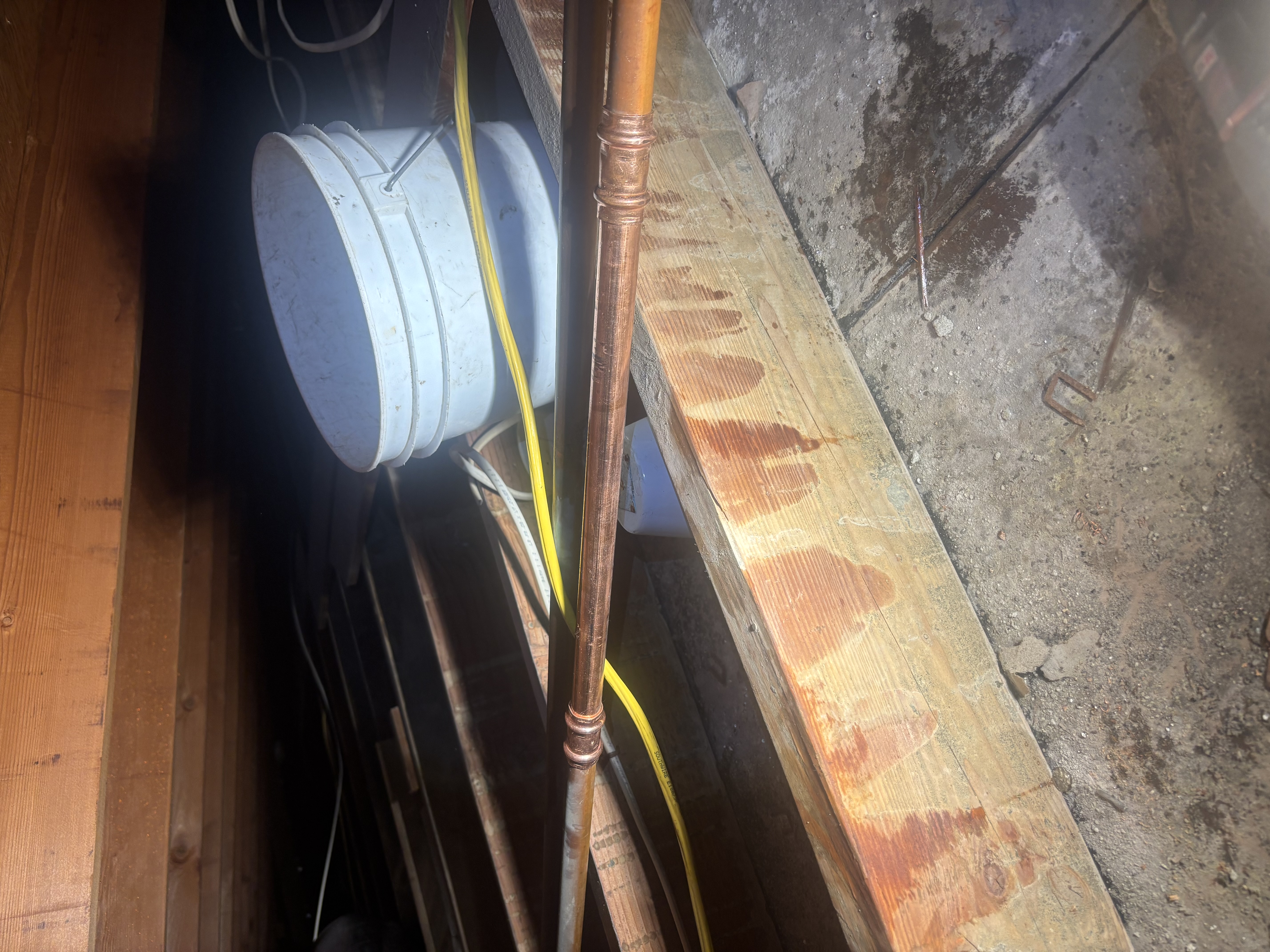 Island Plumbing demonstrates careful crawlspace plumbing with clean copper runs and attentive leak control to protect your home.