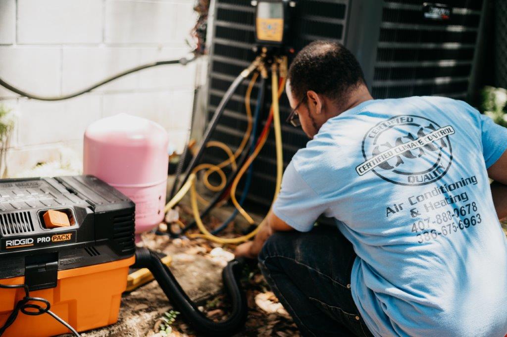 Certified Climate Control ensures your air conditioning needs are met with professionalism and expertise, as shown by our dedicated technicians at work.