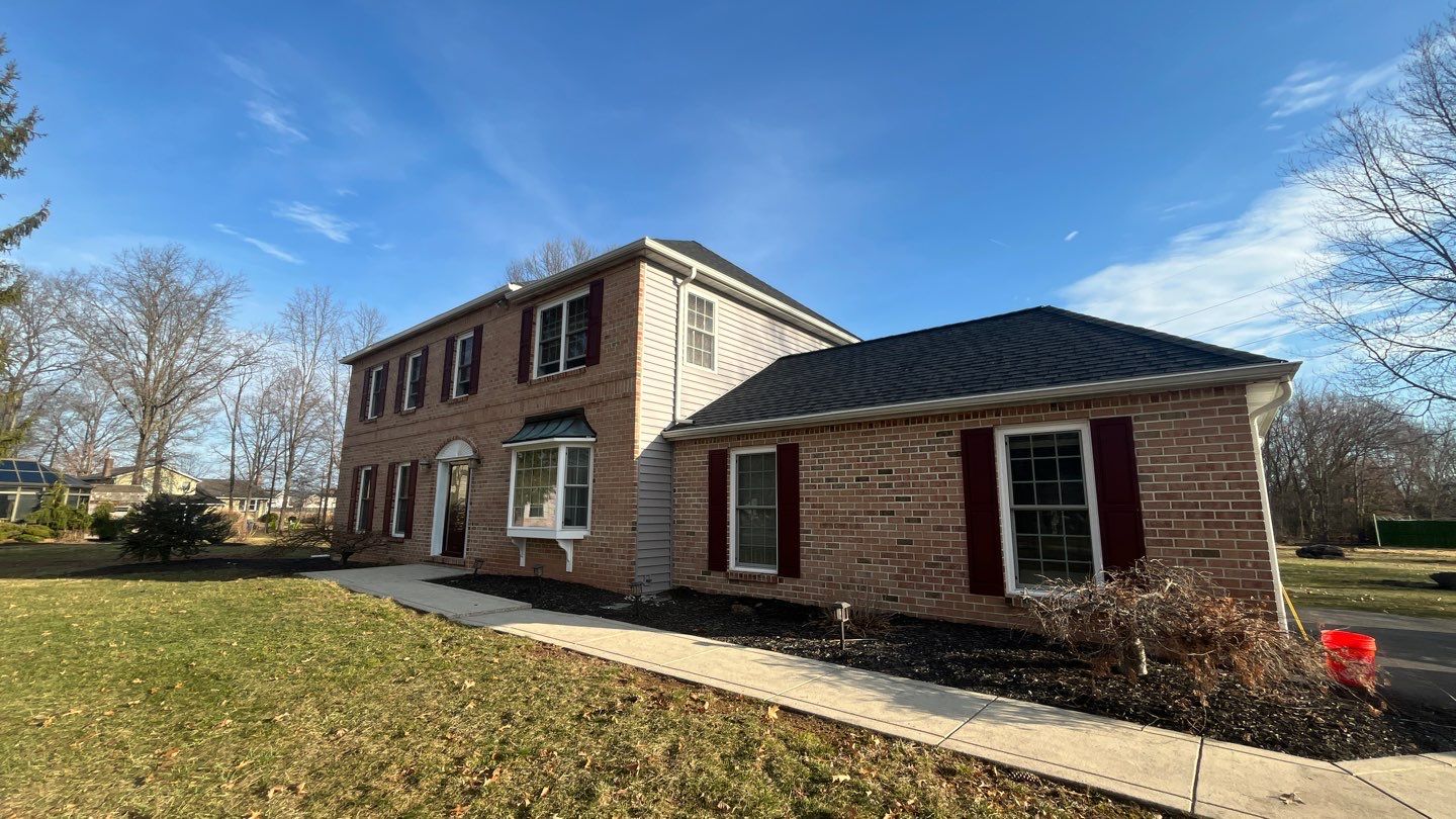 Showcasing lasting protection and neat craftsmanship, Mast Roofing & Construction restored this home's roof and curb appeal with care.