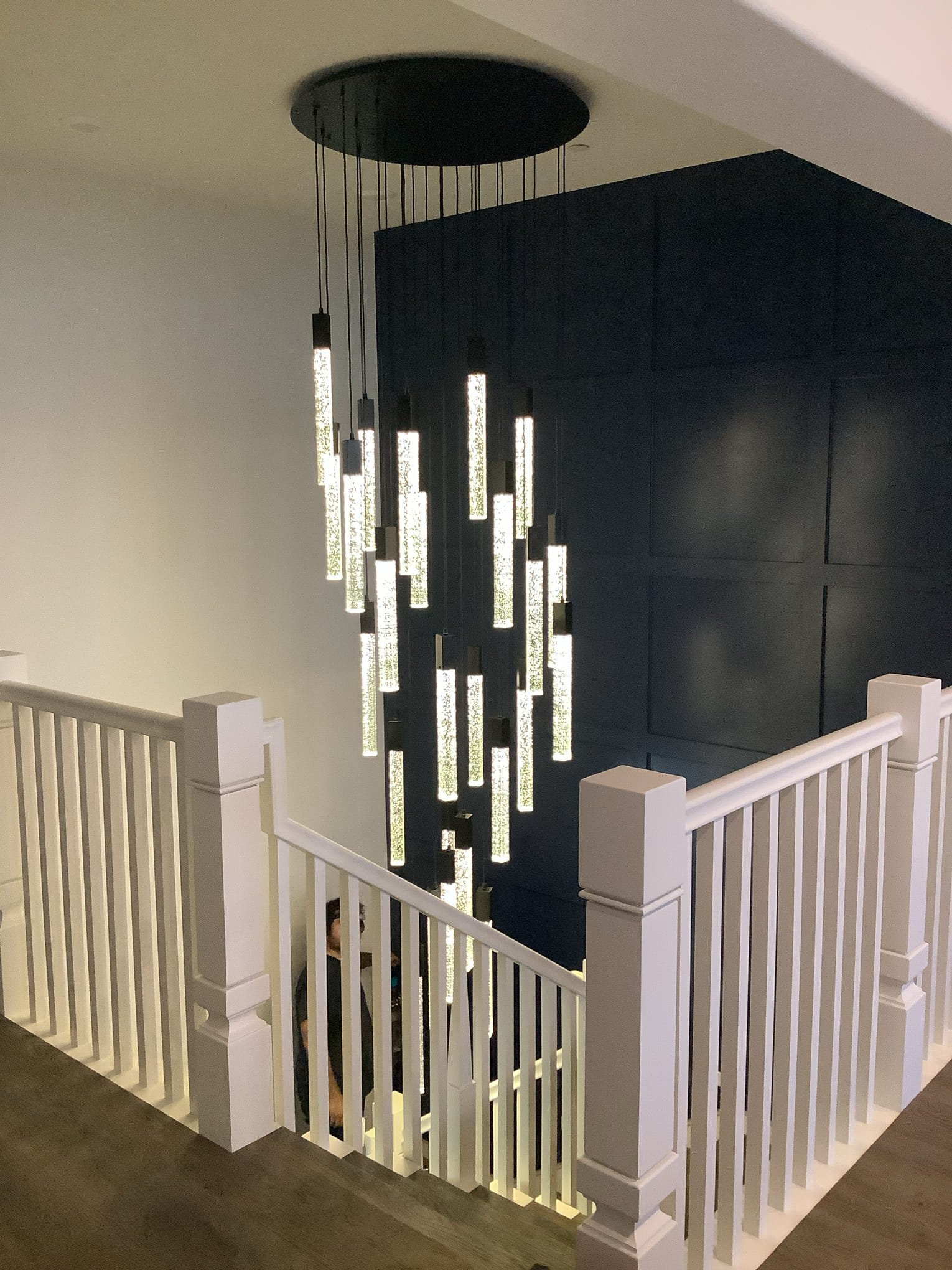 Powell Electric transformed this stairwell with elegant pendant lighting, creating a polished and secure focal point homeowners trust.