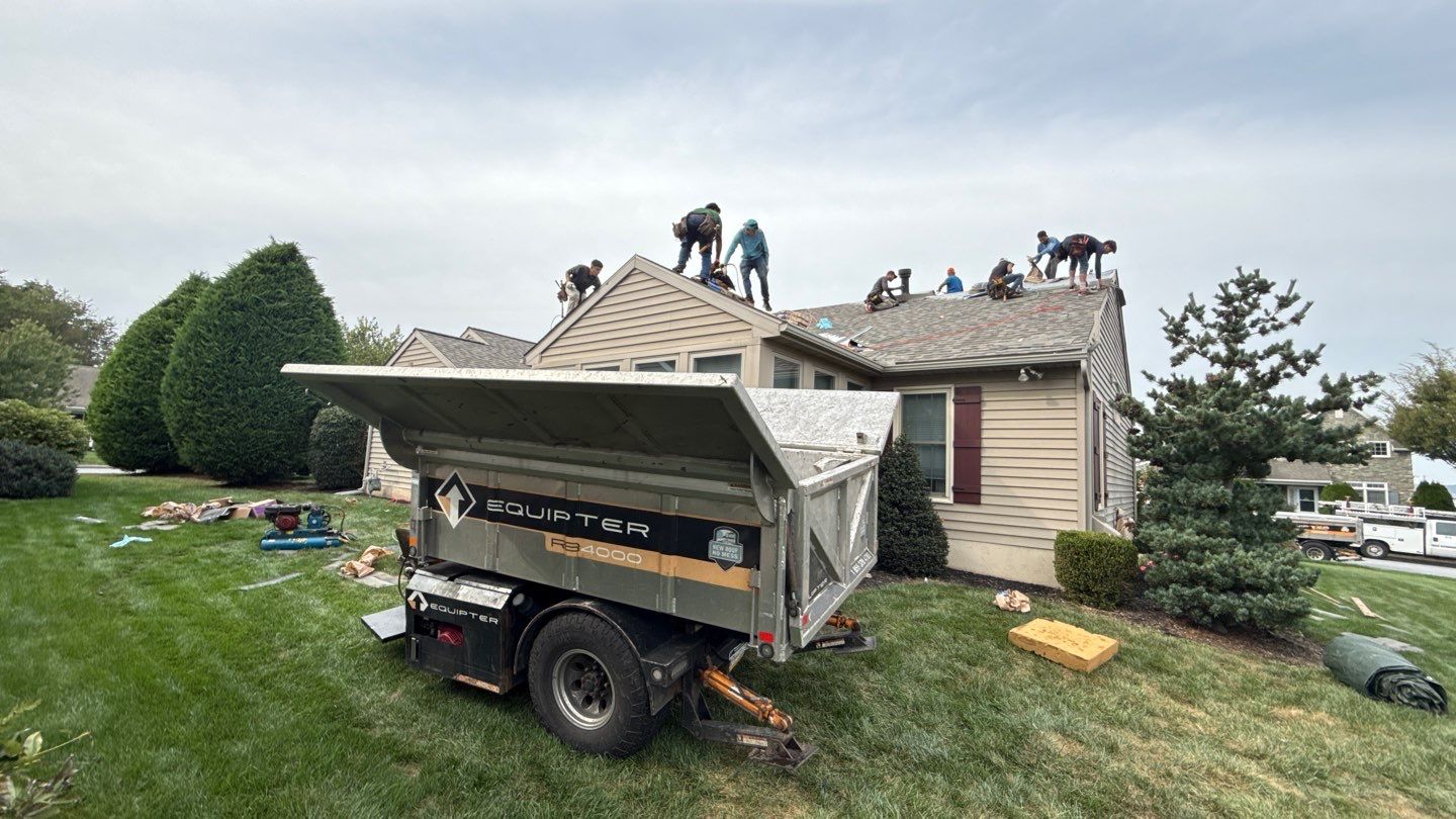 Skilled roofers from Mosaic Roofing & Exteriors restore this home with efficient teamwork and visible attention to cleanup and durability.