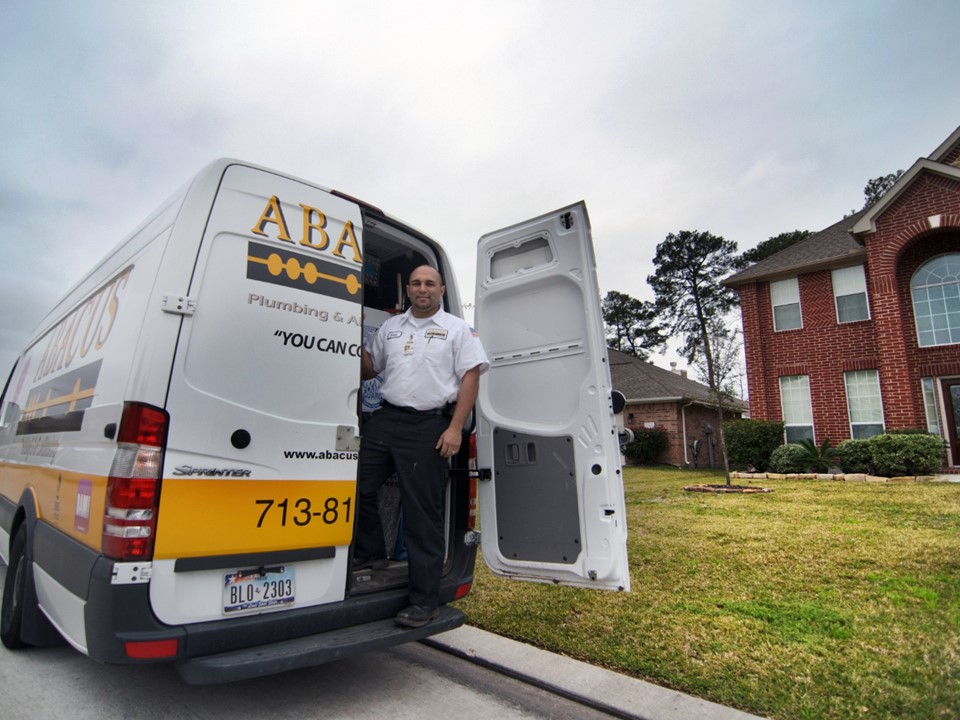 A friendly technician arrives ready to help, showcasing Abacus Plumbing, Air Conditioning & Electrical's reliable on-site service and professionalism.