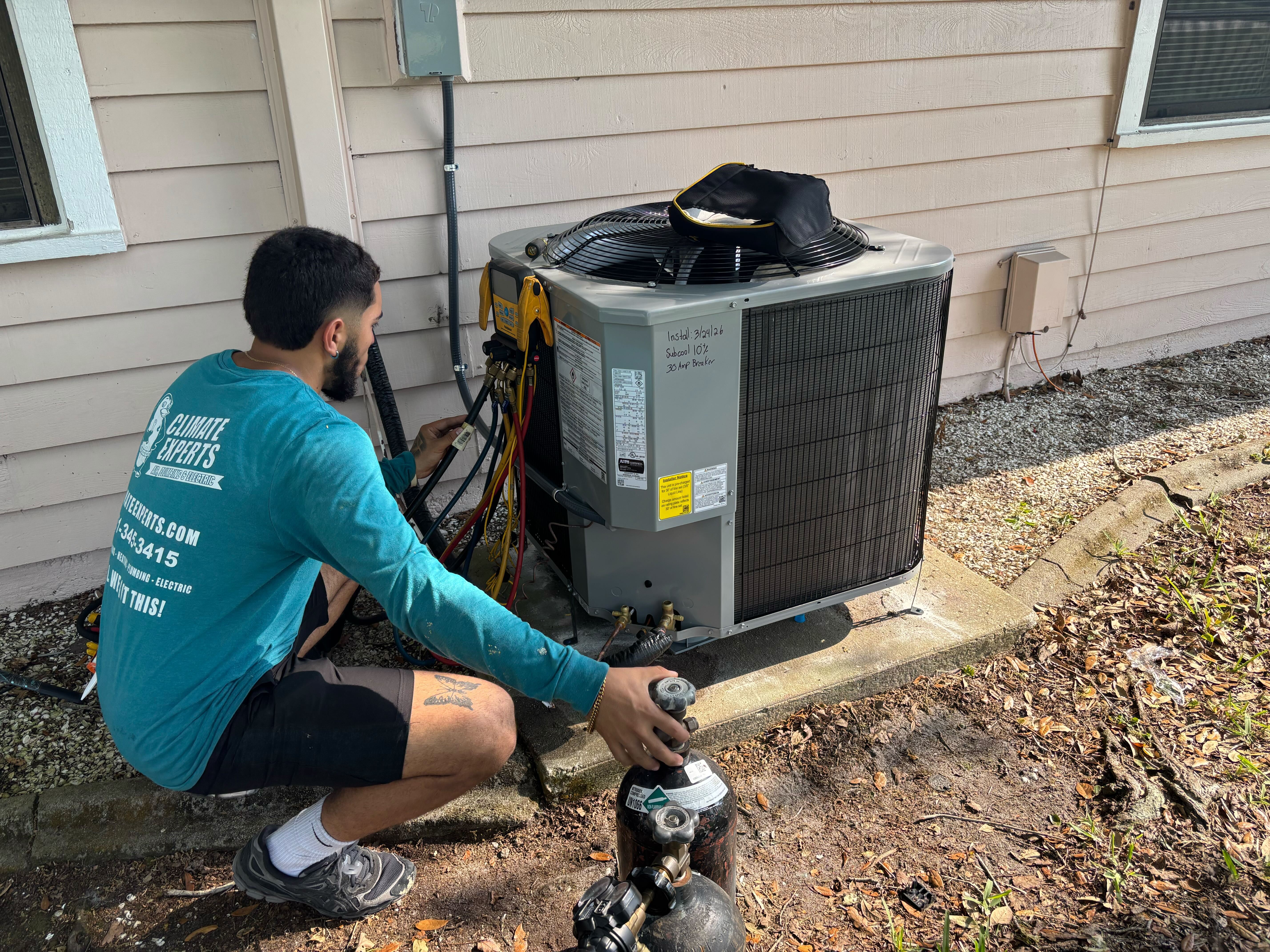 Skilled technicians from Climate Experts Air, Plumbing & Electric perform precise on-site AC service to ensure reliable cooling and lasting comfort.
