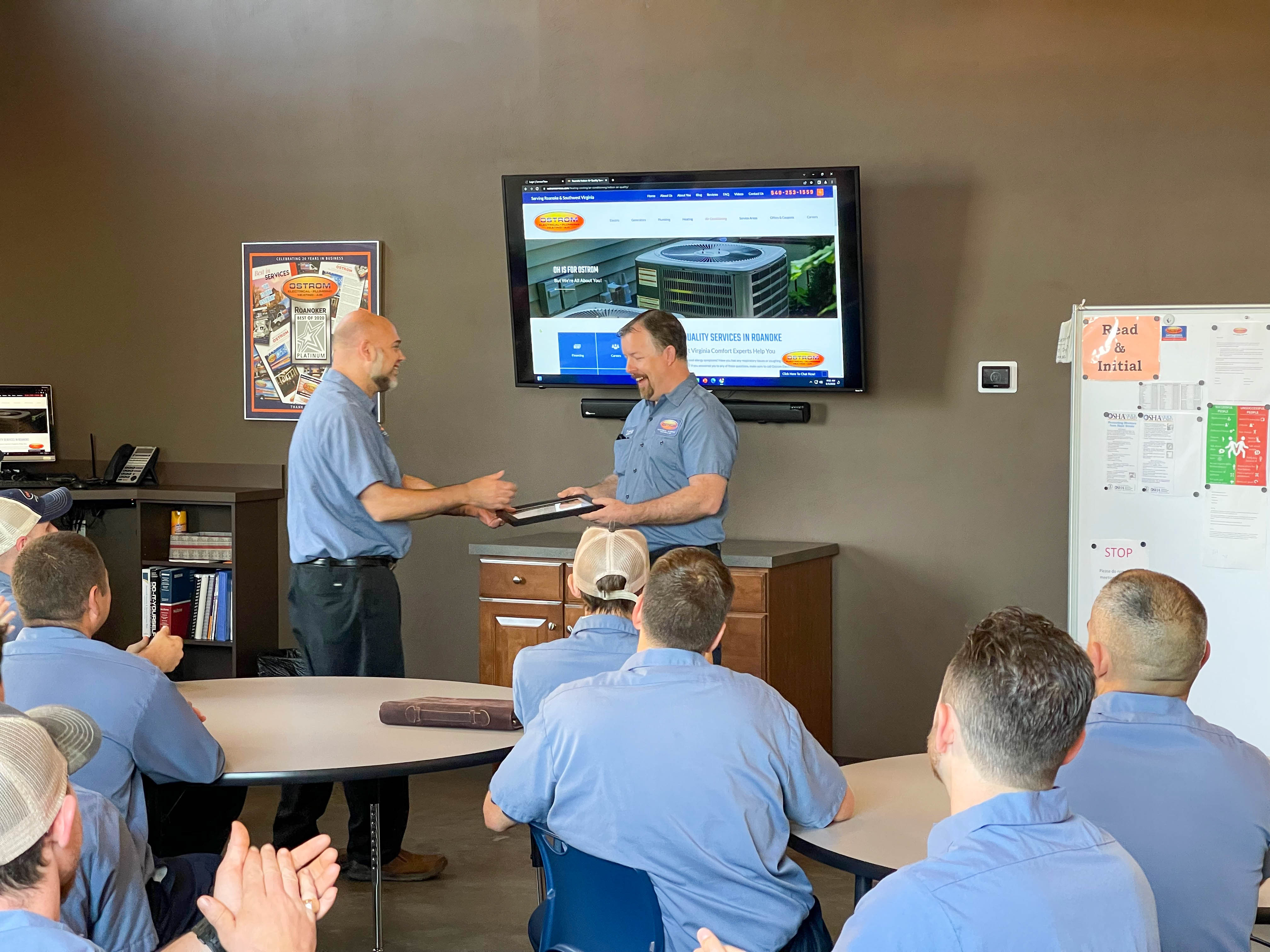 Ostrom Electrical Plumbing Heating & Air Conditioning celebrates excellence, emphasizing professionalism and customer-focused service.
