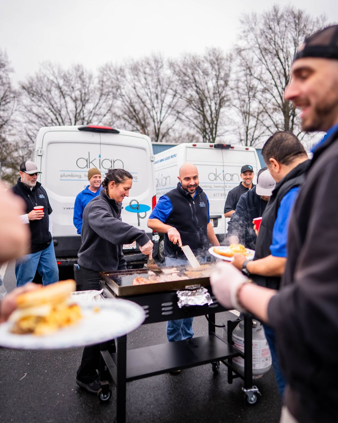 Akian Plumbing, Heating, Cooling & Electric shows team camaraderie and reliability at a neighborhood cookout, reinforcing trust and local service.