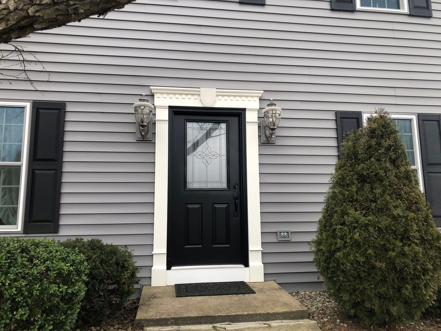 Enhance your home's curb appeal with high-quality door and siding installation from Mast Roofing & Construction.