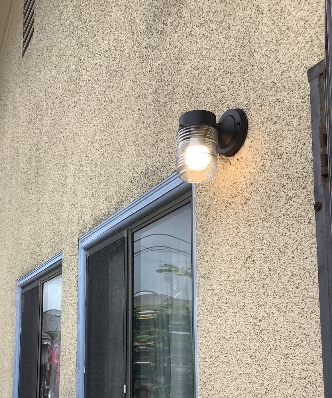 A bright, professionally installed exterior light enhances safety and curb appeal, showcasing Powell Electric’s dependable craftsmanship.