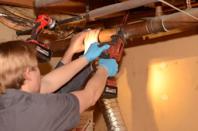 Dependable plumbing craftsmanship in action, Lloyd Plumbing, Heating, Air, Electrical restores pipes quickly and with careful attention to detail.