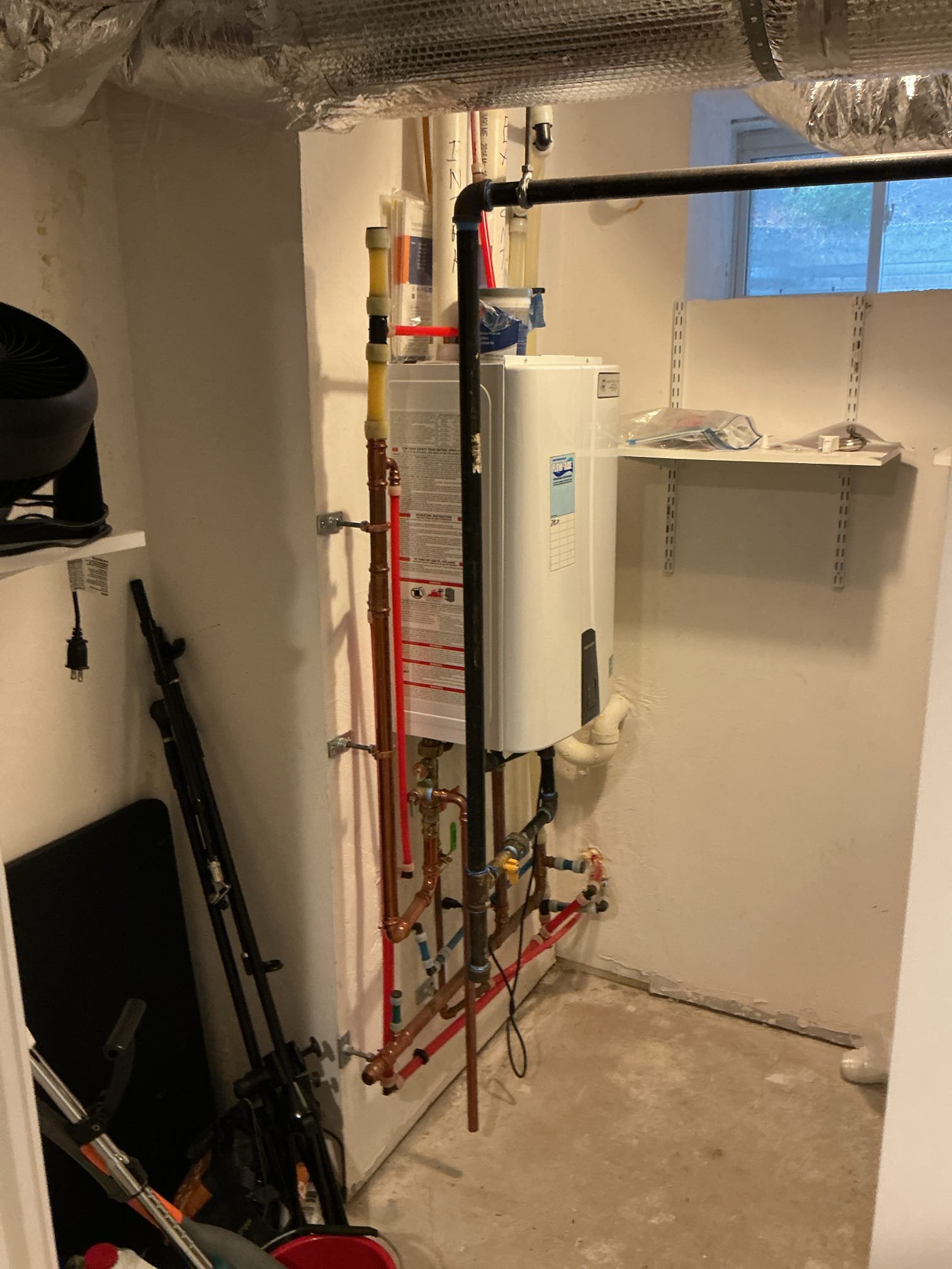 Akian Plumbing, Heating, Cooling & Electric installed this compact, space-saving tankless unit with tidy piping to deliver reliable, efficient home comfort.