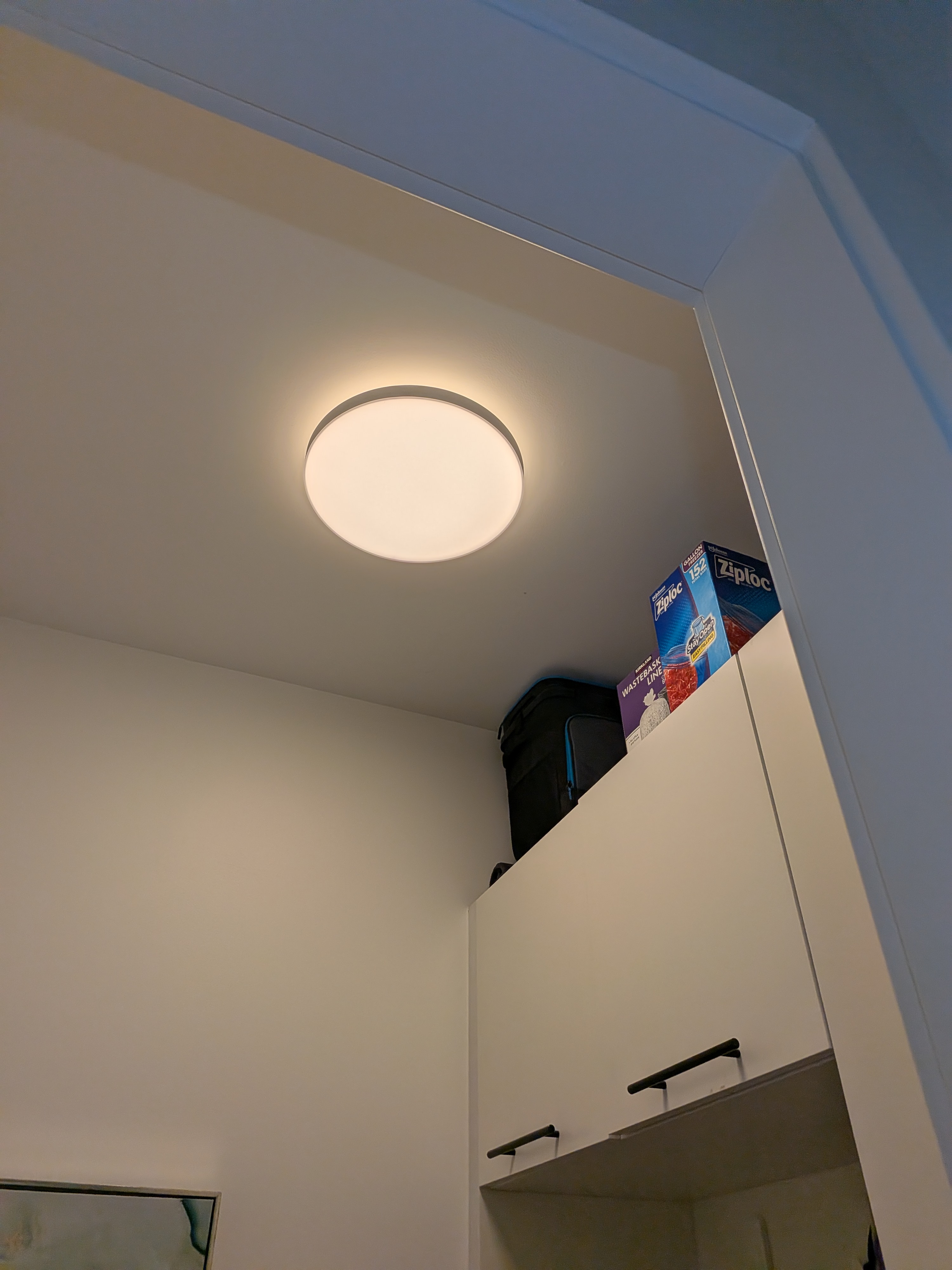 Bright, streamlined lighting enhances this tidy residential space, showcasing Dawson's Electric & Air attention to clean, reliable installations.