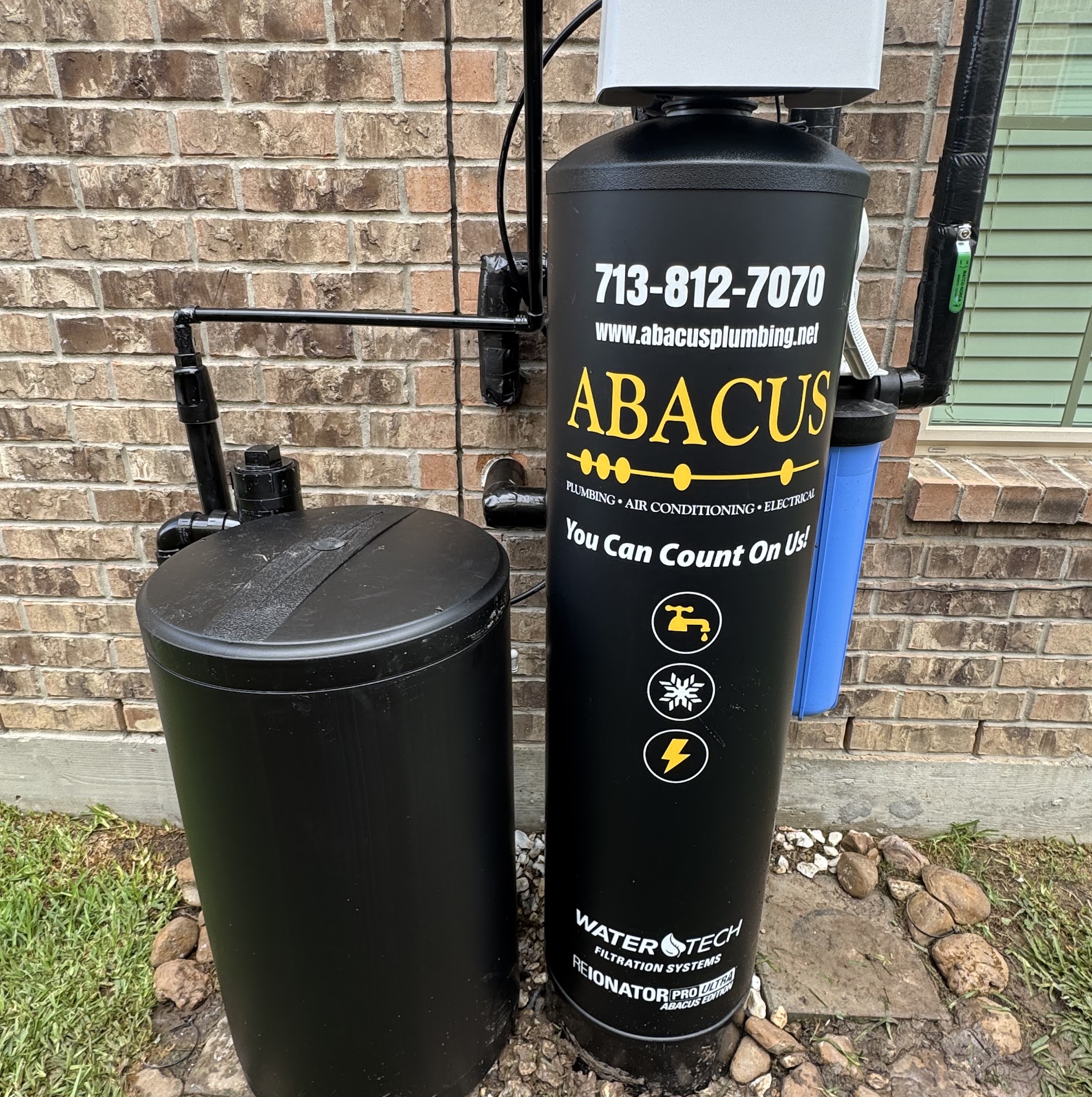 Clean, professionally installed water filtration equipment shows the care and reliability Abacus Plumbing, Air Conditioning & Electrical brings to every home service visit.