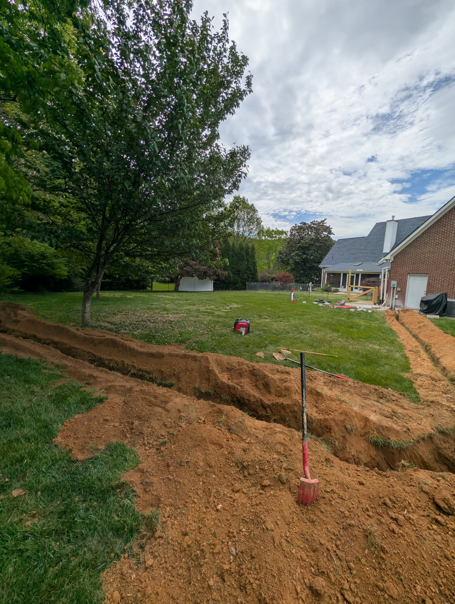 Atomic Electric Service Inc. shows careful trenching and site care for a residential electrical project, demonstrating dependable craftsmanship.
