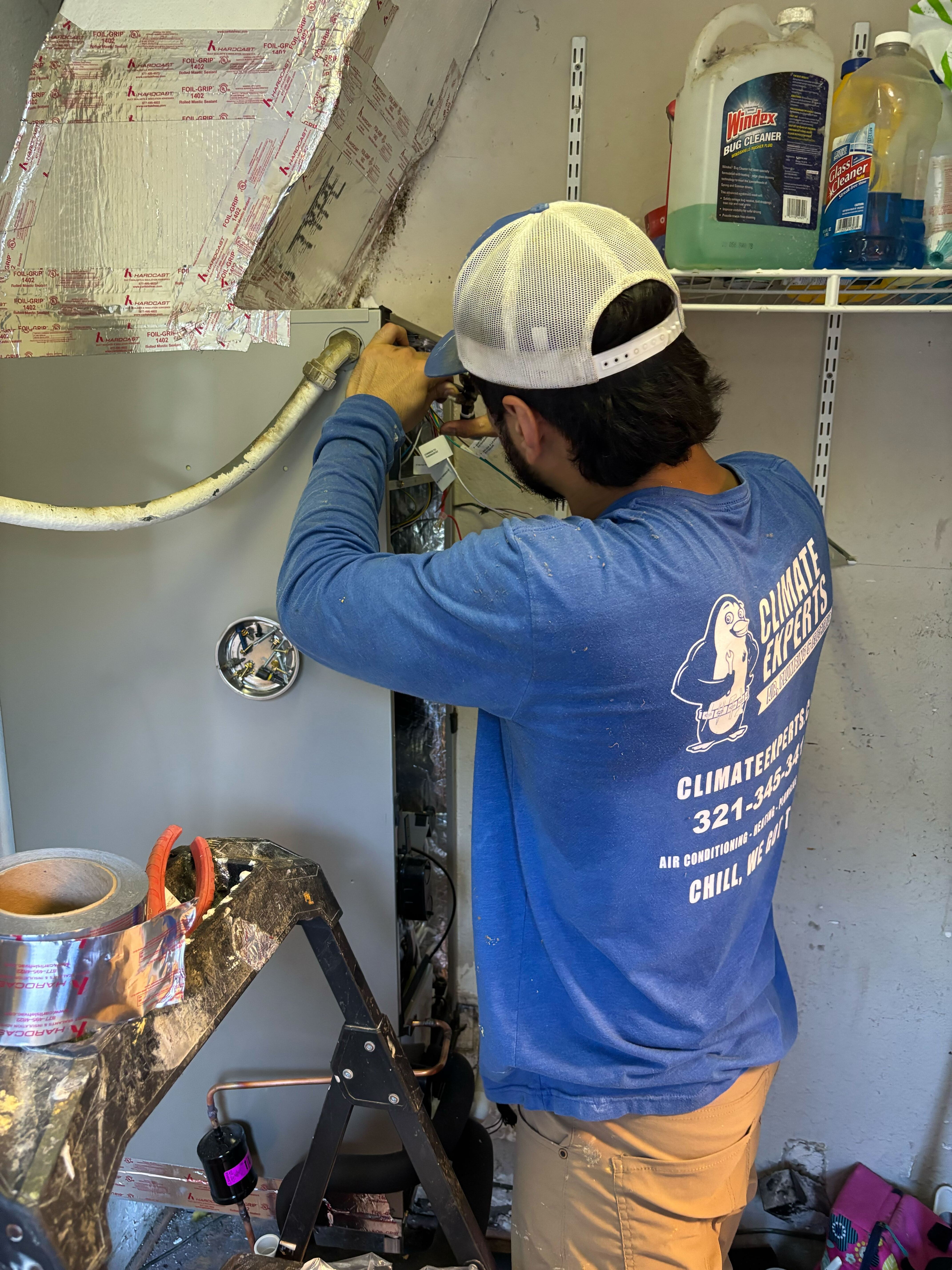 A skilled technician from Climate Experts Air, Plumbing & Electric performs careful HVAC repairs to ensure reliable, long lasting home comfort.