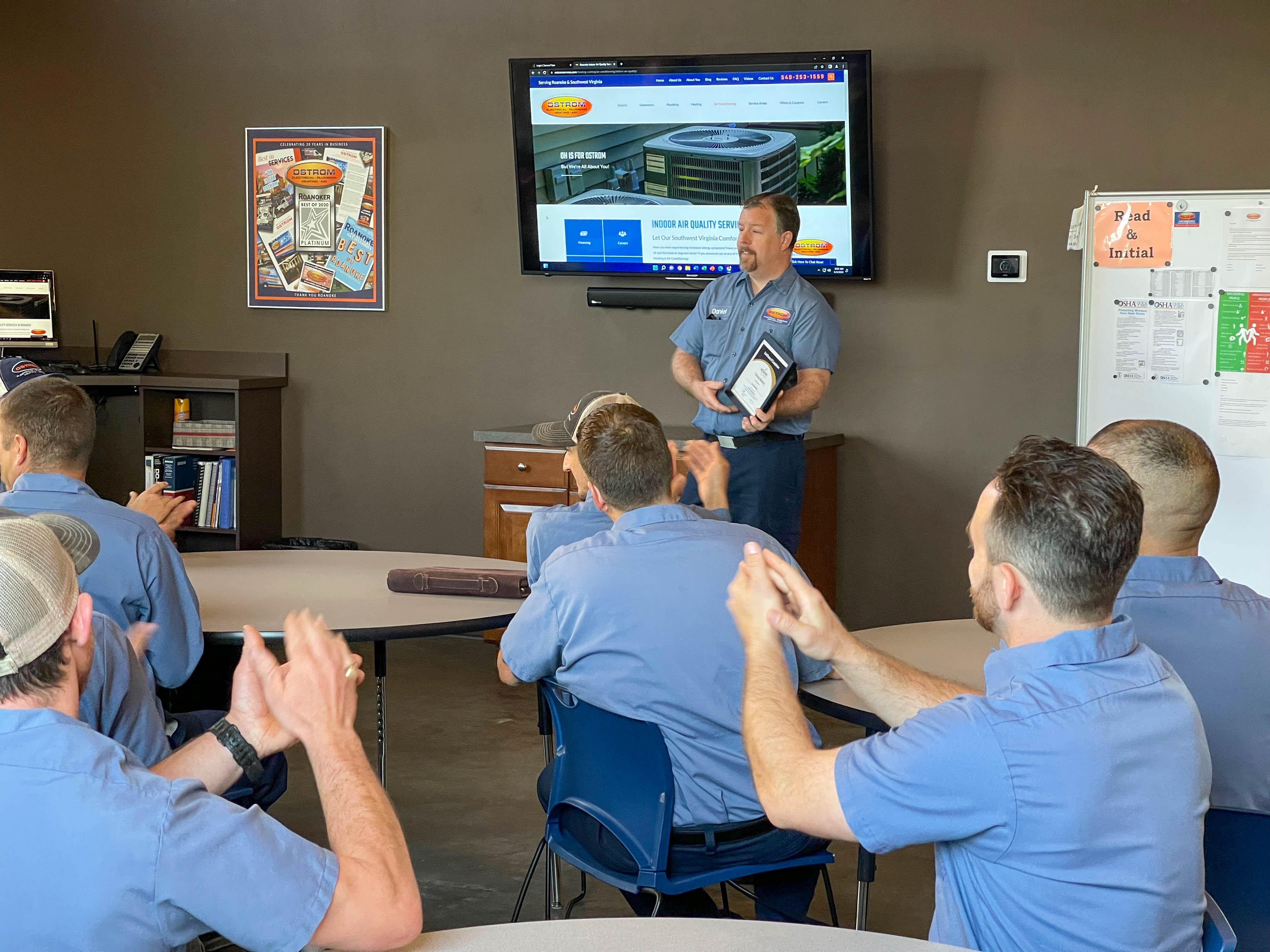 Celebrating excellence and teamwork at Ostrom Electrical Plumbing Heating & Air Conditioning, demonstrating our commitment to professional service and customer satisfaction.
