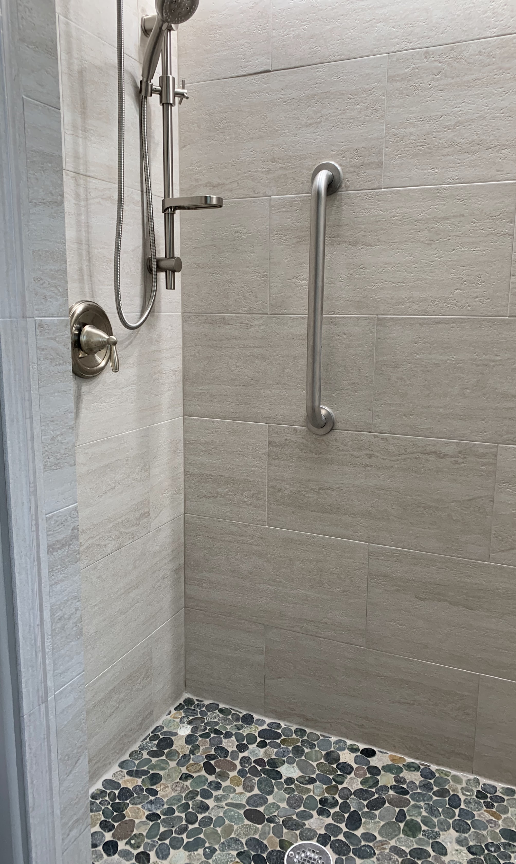 A well-crafted accessible shower with durable finishes shows how Abacus Plumbing, Air Conditioning & Electrical delivers reliable, customer-focused bathroom upgrades.