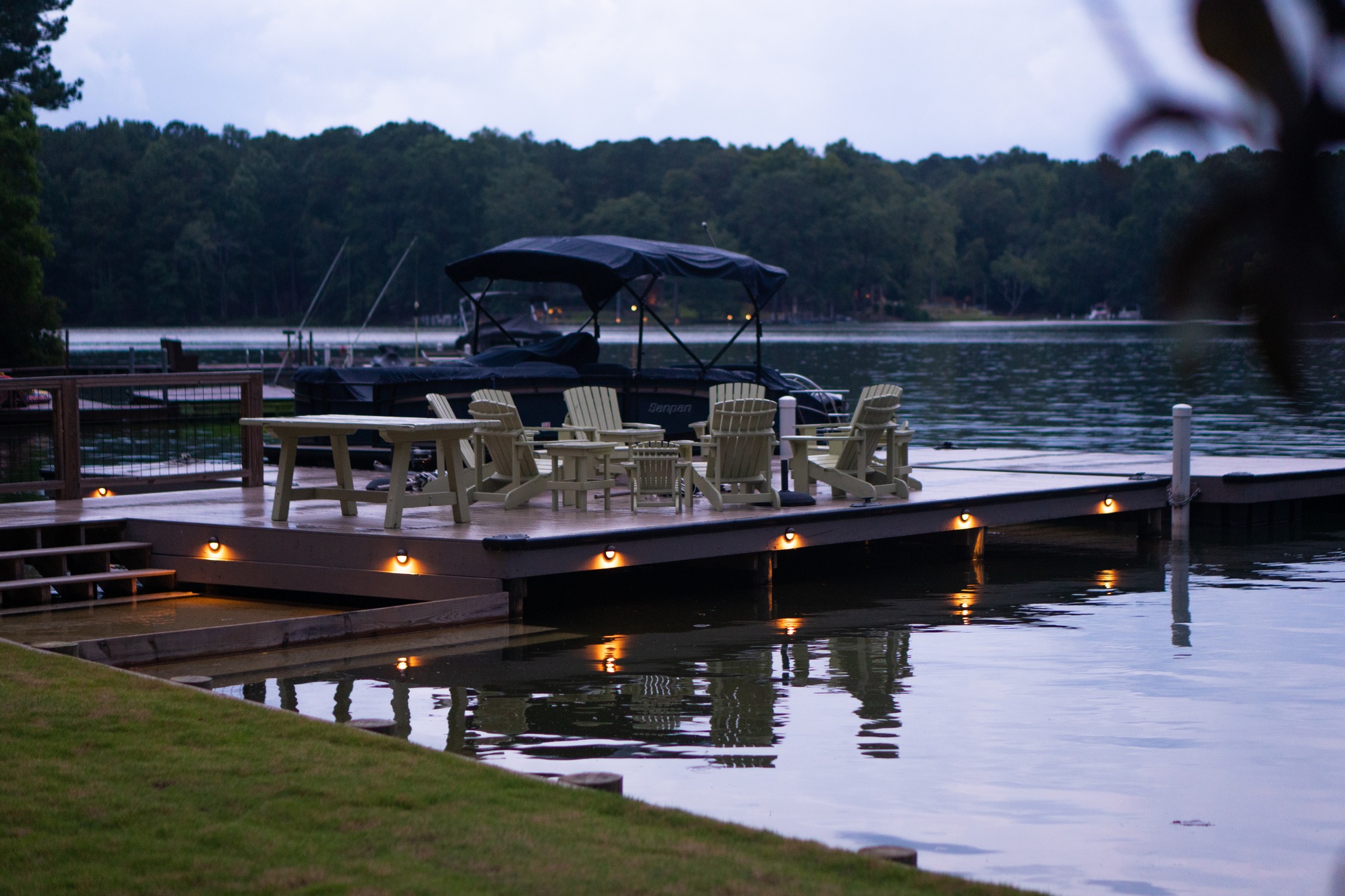 Soft waterfront lighting and tidy dock seating show C&T Electric LLC’s commitment to safe, attractive outdoor electrical solutions.