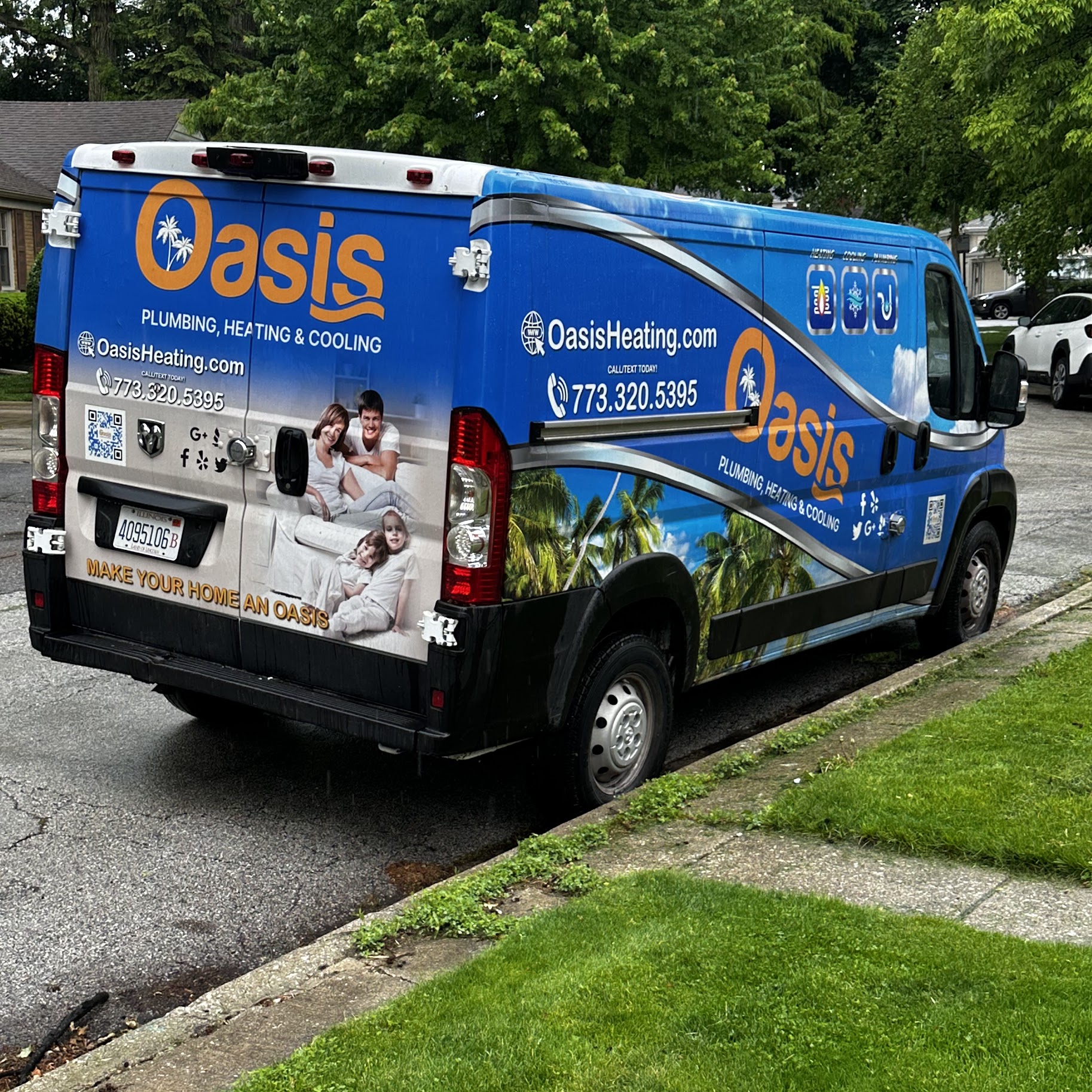A well-branded service van parked at a neighborhood home conveys the trustworthy, professional service Oasis Heating and Cooling brings to your doorstep.