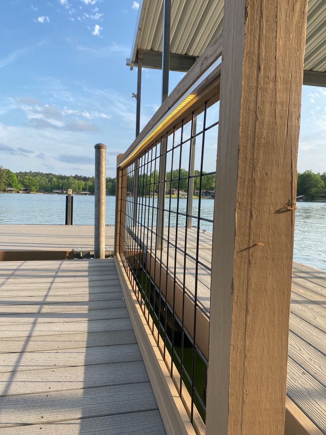Evening-ready dock lighting and neat railing installation show C&T Electric LLC's commitment to durable, high-quality waterfront workmanship.